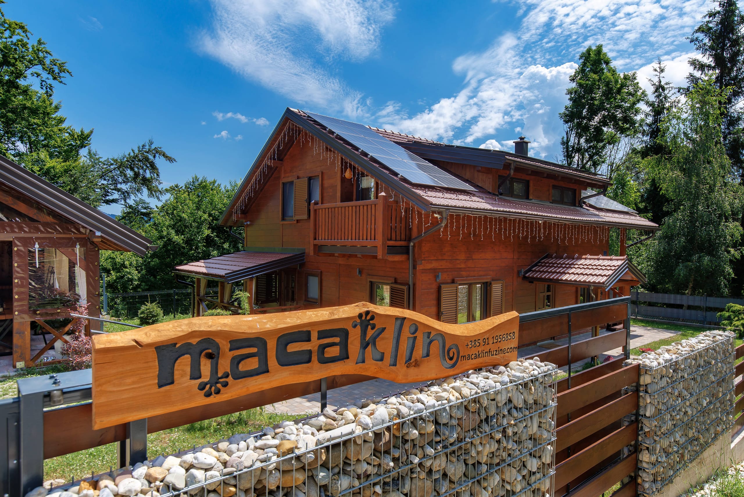 The Macaklin wooden house among pine forest above Lake Bajer in Fužine
